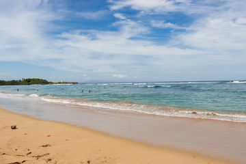 Fototapeta na wymiar Beautiful tropical beach with lush vegetation
