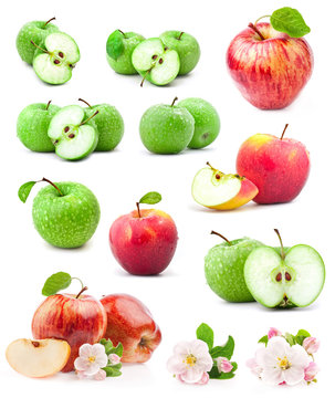 Red and green apples with leaves and water drops on a white back