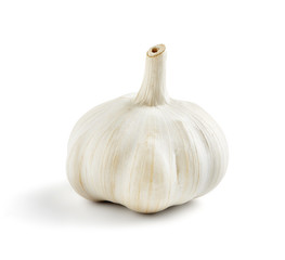 single fresh and tasty garlic on a white backround