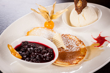tasty sweet pancakes with vanilla icecream and topping
