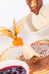 tasty sweet pancakes with vanilla icecream and topping