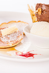 tasty sweet pancakes with vanilla icecream and topping