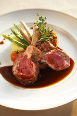 close up pork ribs steak and sauce in white dish