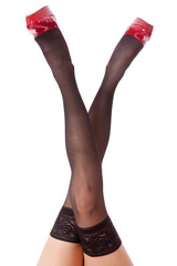 Sexy woman in black lacy tights and red stilettos