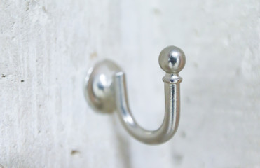 Stainless steel hook on concrete wall