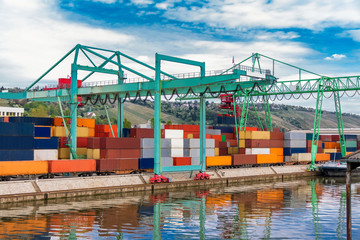 Shipyard with containers and cranes