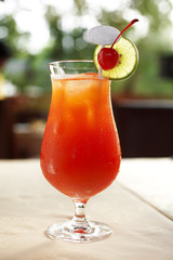 close up carrot and cherry juice in glass