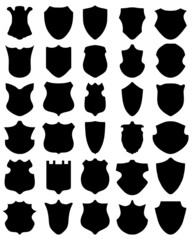 Black silhouettes of different shields, vector illustration
