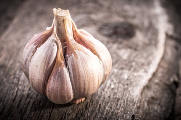 garlic bulb on rustic wooden background