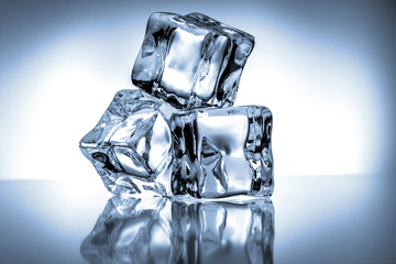 Ice cubes on blue background