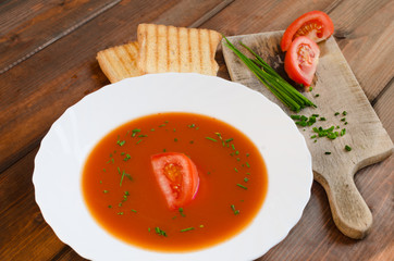 Tomato soup with toast and chive