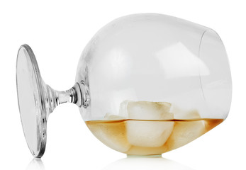Whiskey with ice in inverted glass