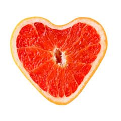 Grapefruit in shape of heart, isolated on white