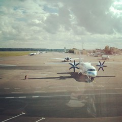 Airplane on an airdrome. View from the airport terminal.