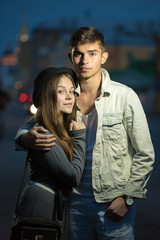 The guy and the girl cost having embraced in the street