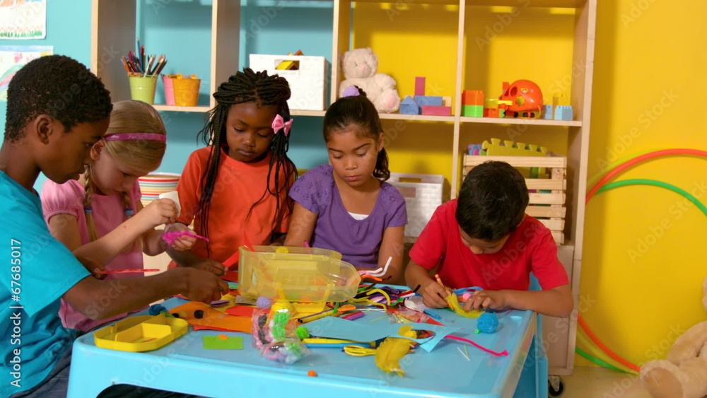 Poster cute little pupils playing with modelling clay in classroom