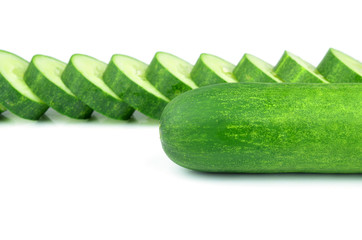 Cucumber and slices isolated over white background