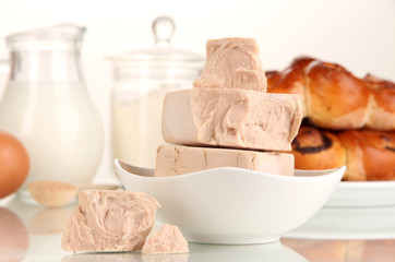 Dry yeast with pastry and baking ingredients isolated on white