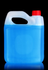 Blue liquid for car in canister on black background