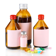 Pills and medicine bottles isolated on white