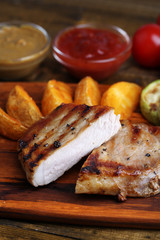 Grilled steak, grilled vegetables and fried potato pieces