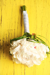 Beautiful wedding bouquet on  color wooden background