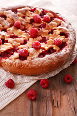 Tasty cake with berries on table close-up