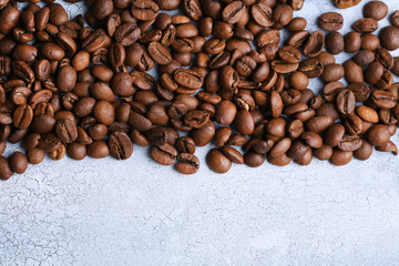Coffee beans on color wooden background