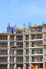 Building construction site work against blue sky