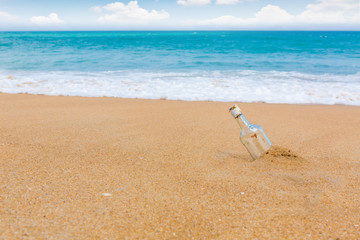 Fototapeta na wymiar Bottle on a beach