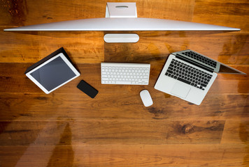 Computer ,laptop , tablet , smart phone on wood table