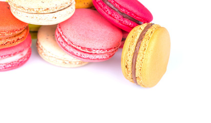 French colorful macarons on white background