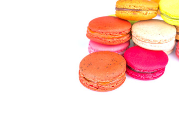 French colorful macarons on white background
