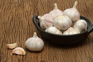 Organic garlic on the wooden background