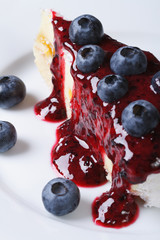 blueberry cheesecake drizzled with berry sauce. macro