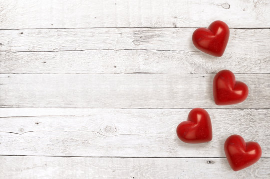 red hearts on a wooden background for lovers and valentine day