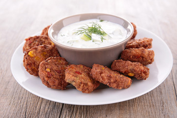 yogurt sauce and falafel