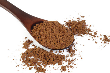 cacao powder in wooden spoon