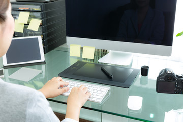 Closeup of business woman hand typing on keyboard computer