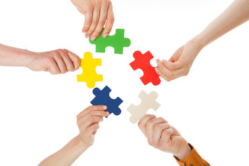 Friends Holding Colorful Jigsaw Pieces