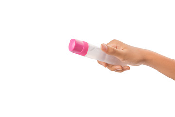 Female teenage hand holding colorful glue bottles 