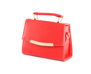 Red handbag of texture leather isolated on white.