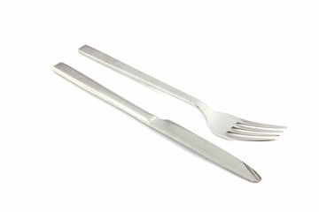 fork and knife of stainless steel on white.