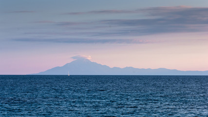 View of the holy Athos mountain from Thassos island at sunset