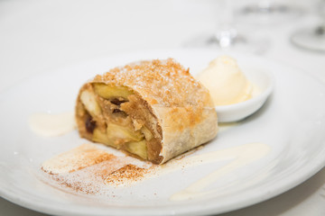 Apple Tart on Plate with Vanilla Ice Cream and Cinammon