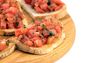 Italian bruschetta on a wooden cutting board