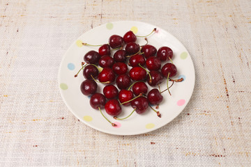 Fresh red cherries in a bowl