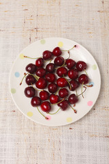 Fresh red cherries in a bowl