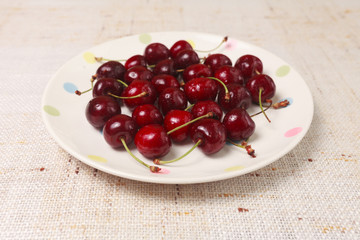Fresh red cherries in a bowl