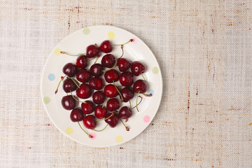 Fresh red cherries in a bowl